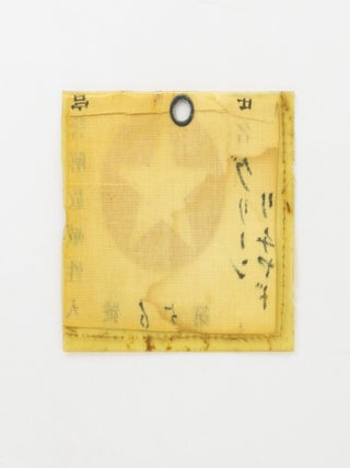 The identity tag or pass of one Richard Green, a prisoner-of-war of the Japanese during the Second World War