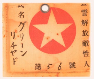 The identity tag or pass of one Richard Green, a prisoner-of-war of the Japanese during the Second World War