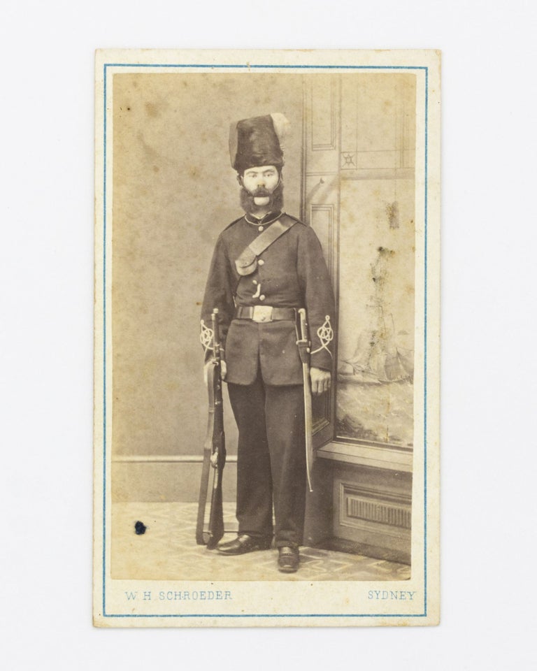 Item #100968 A carte de visite photograph of a man in military uniform, complete with distinctive tall fur cap, rifle and sword-bayonet. Uniformed Soldier.