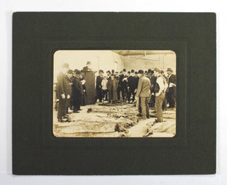 Item #102329 A vintage photograph of an auction of hides and skins in progress. Portrait of an...
