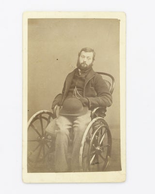 Item #102699 A carte de visite photograph of a relatively young man in a wheelchair. Portrait of...