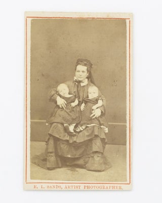 Item #102701 A carte de visite photograph of a young woman holding twin baby girls. Portrait of...