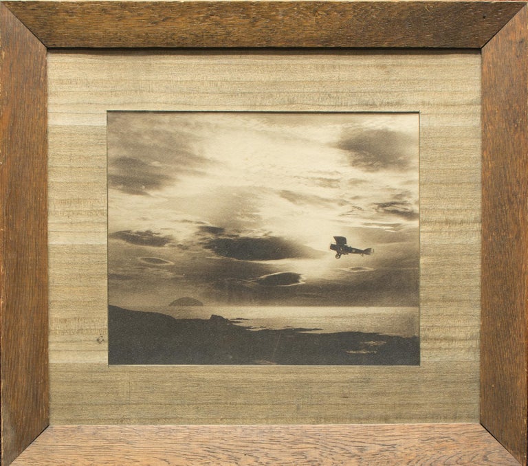 Item #107816 A striking sepia-toned photograph of a Bristol F.2B biplane piloted by pioneering Australian aviator Captain Harry Butler while on an anti-submarine patrol off the coast of Scotland in late 1917 or 1918. At the time Butler was fighting-instructor at the Royal Flying Corps School of Aerial Gunnery and Fighting at Turnberry (now a Trump golf resort). Aviation.