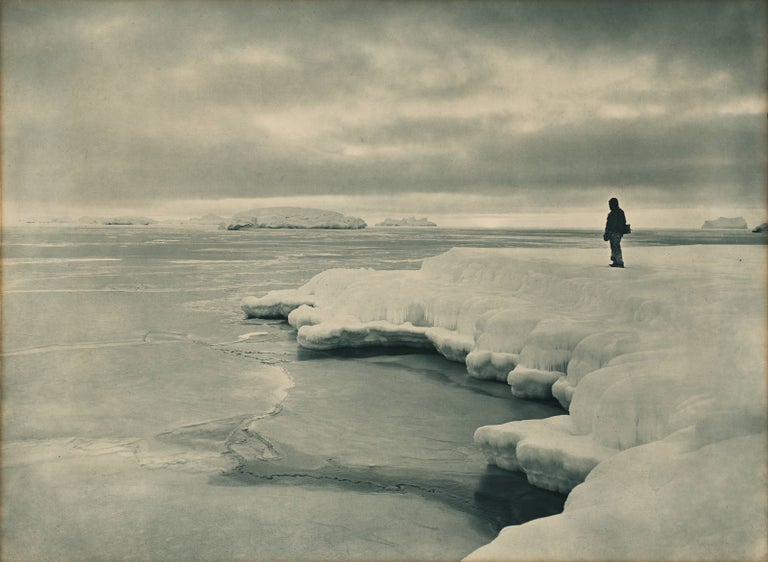 Item #108644 'The Pallid Glow of a Midwinter Noon at Cape Denison' [Australasian Antarctic Expedition, 1911-1914]. Australasian Antarctic Expedition, Frank HURLEY.