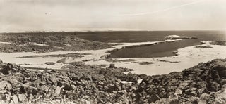 Item #108655 A panoramic view of Cape Denison, showing the Winter Quarters of the Australasian...