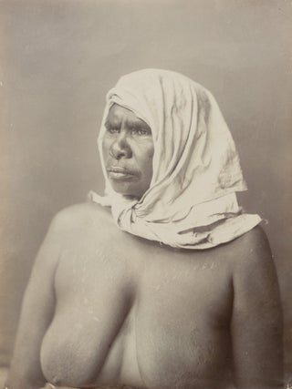 A fine portrait of an Indigenous Australian woman with traditional scarification, wearing a plain head-scarf knotted under her chin