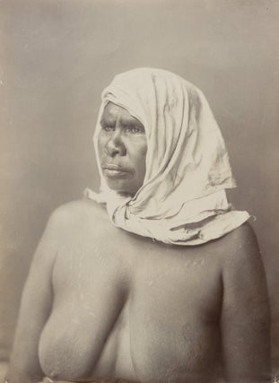 A fine portrait of an Indigenous Australian woman with traditional scarification, wearing a plain head-scarf knotted under her chin