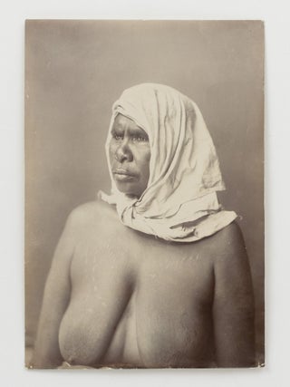 A fine portrait of an Indigenous Australian woman with traditional scarification, wearing a plain head-scarf knotted under her chin