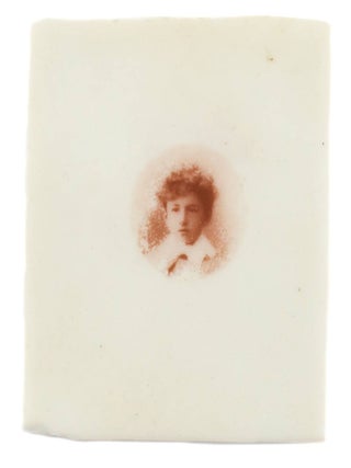 A small sepia-toned portrait photograph printed on ivory (image size, a 26 mm circle squared left and right to a maximum of 23 mm, on a support 50 × 25 mm)