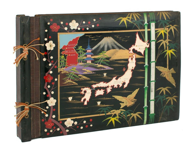 Item #110834 A large photograph album of Japanese origin and Korean War vintage, with the lacquered front cover extensively hand-decorated in colour. Japan and Korea.