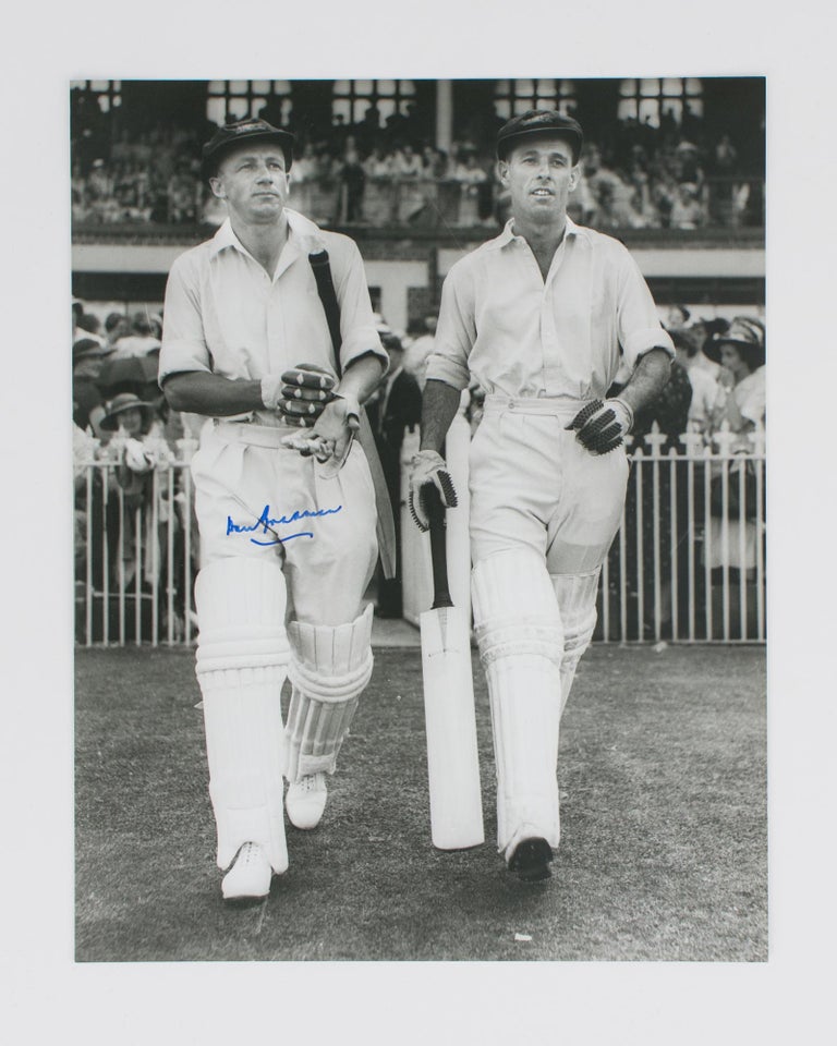 Item #114804 An original signed photograph of Don Bradman walking out to bat with Jack Fingleton. Cricket, Don BRADMAN.