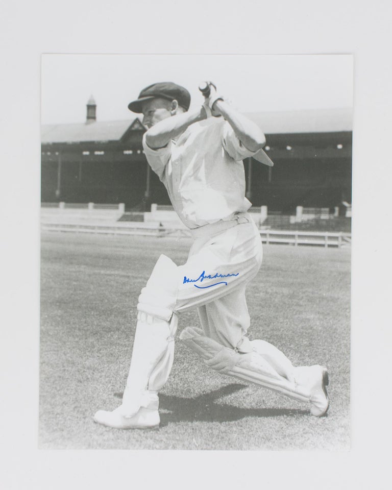 Item #114805 A signed photograph of Don Bradman executing a cover drive. Cricket, Don BRADMAN.