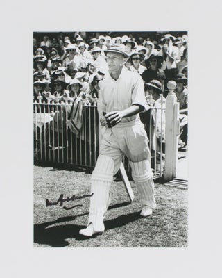 Item #114809 An original signed photograph of Don Bradman executing a cover drive. Cricket, Don...