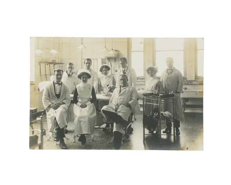 Item #114880 A vintage photograph of a hospital operating theatre, complete with nine doctors and nurses - and a dog. Hospitals.
