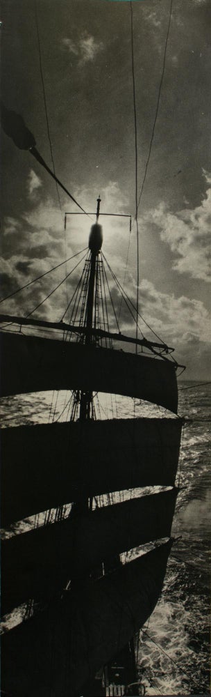 Item #114972 The mainmast of SY 'Discovery' silhouetted against the sun, taken from the fore topgallant yard. BANZARE, Frank HURLEY.