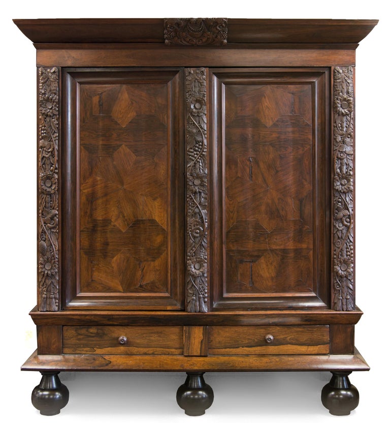 Item #114986 A very large and impressive Dutch rosewood veneer and carved oak 'rankenkast' ('tendril cabinet') or armoire, dating from the second half of the seventeenth century