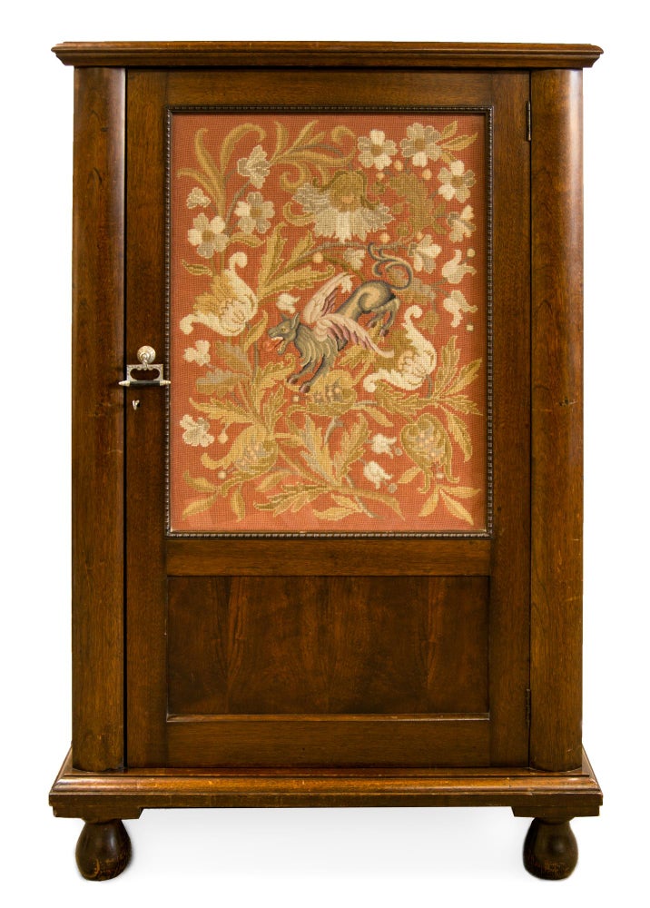 Item #114988 An Edwardian crystal cabinet with a large decorative panel, embroidered in gros point and petit point by Lady Paquita Mawson or her mother, Henrietta Delprat, mounted behind the original glass panel in the door