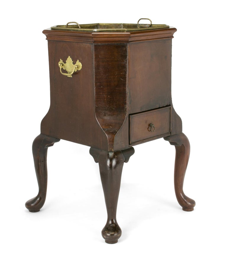 Item #114990 A Georgian wine cooler (circa 1750s); oak with mahogany veneer; original brass insert and hardware (the drawer pull a vintage replacement), the whole standing on four cabriole legs with pad feet
