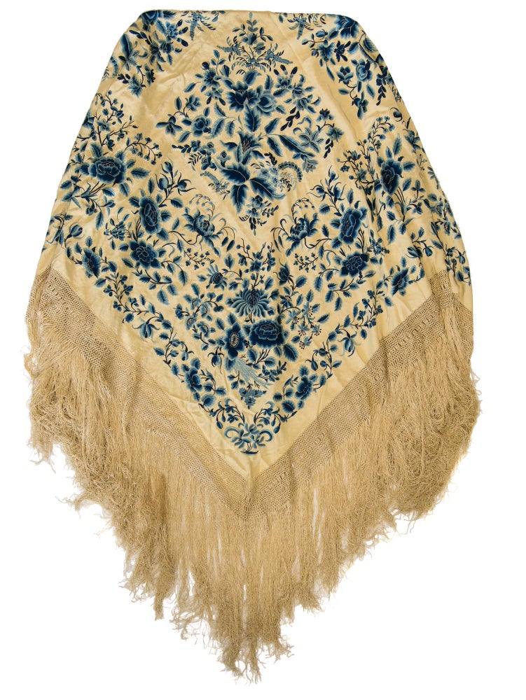 Item #114991 A very large embroidered silk piano shawl or Manila shawl. The cream silk ground is elaborately hand-embroidered on both sides with blue silks in a floral design, and is edged with a knotted silk border and thick, heavy fringe
