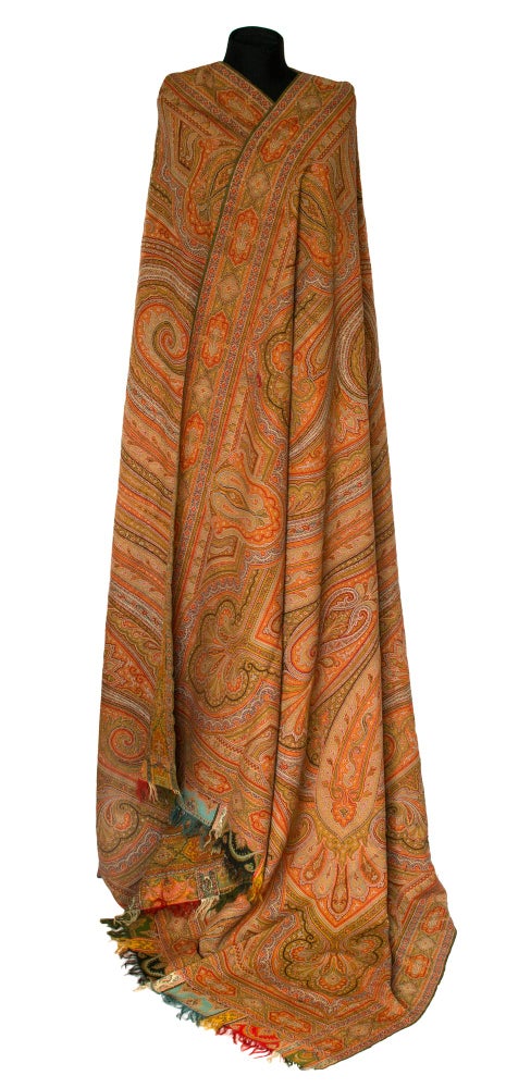 Item #114992 A large Kashmir-style paisley shawl of woven wool, with harlequin borders and fringes to the short ends