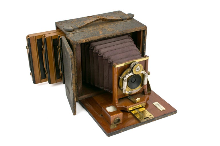 Item #114993 A Rochester Optical Company 4 × 5 Premo B folding plate camera, with burgundy leather bellows, Victor shutter apparatus and three original plate film-holders