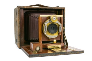 A Rochester Optical Company 4 × 5 Premo B folding plate camera, with burgundy leather bellows, Victor shutter apparatus and three original plate film-holders