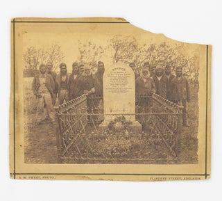 A vintage full-plate albumen paper photograph of a group of fourteen Ngarrindjeri [Narrinyeri] men at the graveside of the Reverend George Taplin at Point McLeay, South Australia