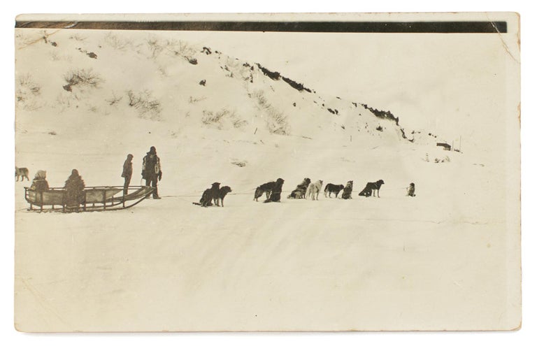 Item #115812 A postcard-format gelatin silver photograph of a dog-sled, with passengers and handlers, addressed to 'Miss Paquita Delprat | Adelaide | S. Australia'. Australasian Antarctic Expedition, Andrew WATSON.