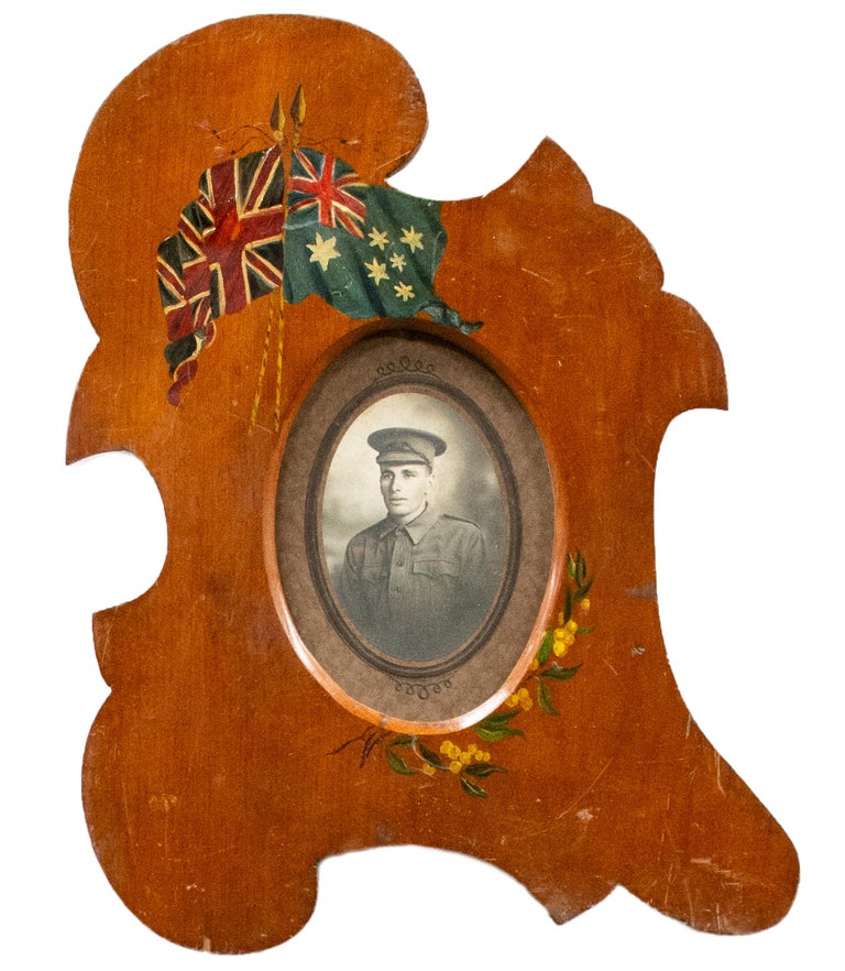 Item #117324 A handmade picture frame with patriotic Australian motifs, containing the photograph of an unidentified Australian soldier from the First World War. Commemoration.