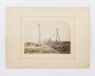 Item #118372 A vintage photograph showing a very large artillery piece being manoeuvered into...