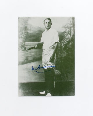 Item #118471 A printed postcard portrait (148 × 105 mm) of Don Bradman, signed in blue ink....