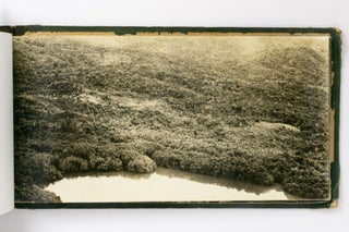 An album of 87 large-format aerial photographs of the New Guinea coastline, circa 1943