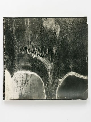 Item #121418 Two aerial photographs of bombing raids on Wewak and Wakde Island. Aerial Photographs