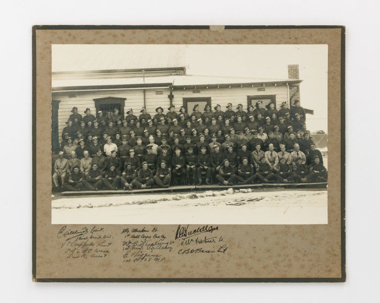 Item #121489 A group photograph of approximately 120 Australian soldiers and eight American servicemen. Group Portrait, American Servicemen.