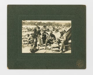 Item #121575 A photograph of a group of young men enjoying an al fresco meal at (we believe to...