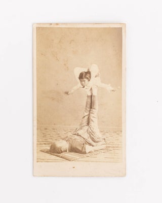 Item #125773 A carte de visite of an adult and child - both Japanese - performing an impressive...