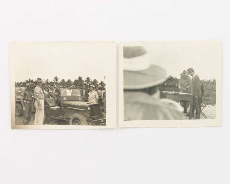Item #125891 Two original photographs of the Surrender Ceremony of the Japanese 2nd Army at Morotai, Halmahera Islands, Netherlands East Indies, on 9 September 1945. Japanese Surrender.