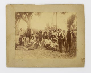 Item #128028 A vintage photograph of a group of men and a few children (including three...