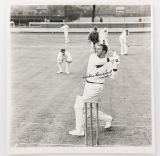 A very large signed vintage photograph (372 × 368 mm) of Richie Benaud, taken in England during a publicity shoot for Gray-Nicolls cricket bats