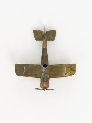 A scratch-built model of a Sopwith Camel, one of the most significant and famous of all First World War aircraft, fashioned around a bullet as the fuselage