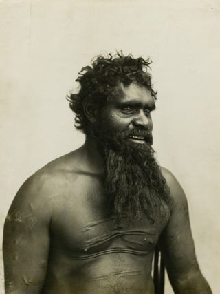 A large portrait photograph of a Central Australian Indigenous man with traditional scarification. Indigenous Australian Portrait, Charles P. SCOTT.