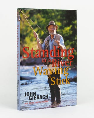 Item #145527 Standing in a River Waving a Stick. John GIERACH