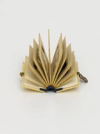 A miniature photograph album containing 10 gem-format portrait photographs, circa 1860s