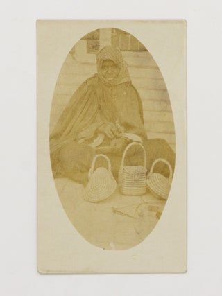 Item #147039 A vintage portrait photograph of Jenny Holmes, a Ngarrindjeri woman, weaving baskets...