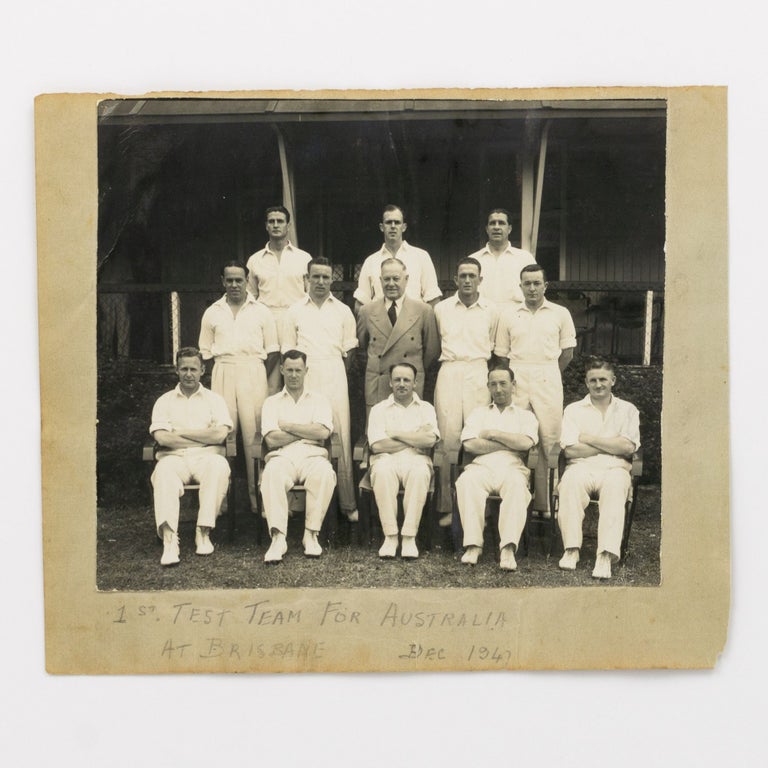 Item #55445 An original photograph (140x160mm) mounted on a detached autograph album leaf (165x195mm), captioned in pencil '1st Test Team for Australia at Brisbane. Dec 1947'. The match was against India on 28-29 November and 1-4 December 1947; it was India's first tour of Australia. The team comprised Bradman (Captain), Brown, Hamence (12th man), Hassett, Ian Johnson, Bill Johnston, Lindwall, McCool, Miller, Morris, Tallon and Toshack; the Manager is also in the group portrait. 1947 Australia.