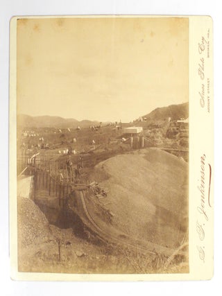 Four large albumen paper photographs of the Broken Hill region. The photographs, each approximately 200 × 225 mm, are on the original glossy cream-coloured mounts with the imprint of the photographer, 'G.F. Jenkinson, Areas Photo Coy, Argent Street, Broken Hill'